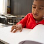 Belgian charities: Discover the work of The Ligue Braille LIGUE BRAILLE BELGIUM Blind boy reading braille